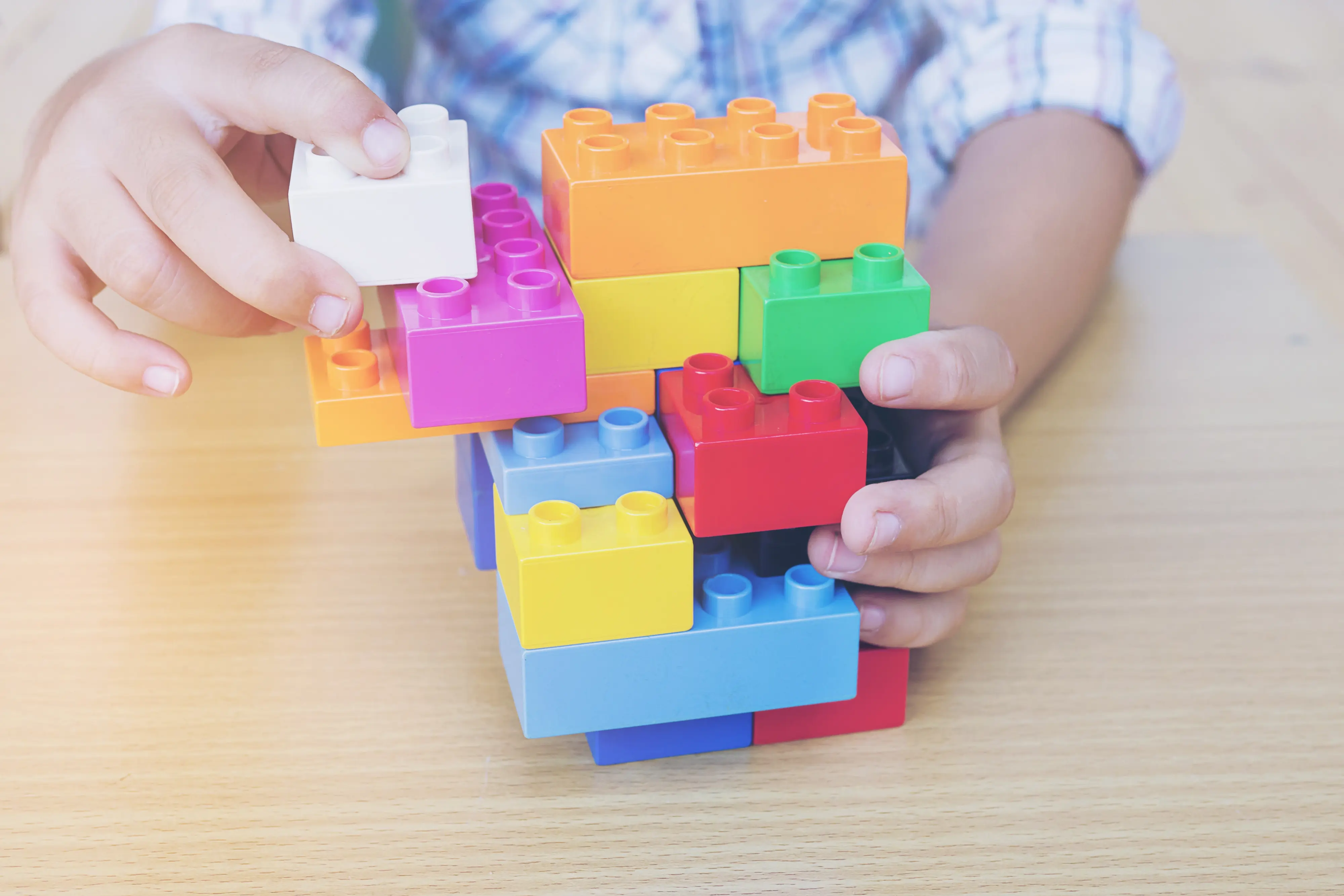 Child playing with creative construction blocks